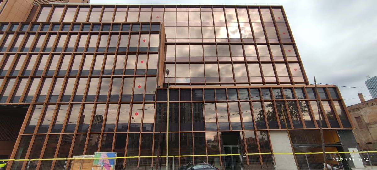 Exterior view of Smart Building façade incorporating Amorphous Silicon Photovoltaic Technology Glass by Onyx Solar