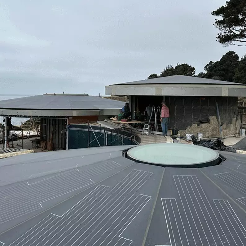 PHOTOVOLTAIC WALKABLE ROOF - TIMBER COVE RESORT