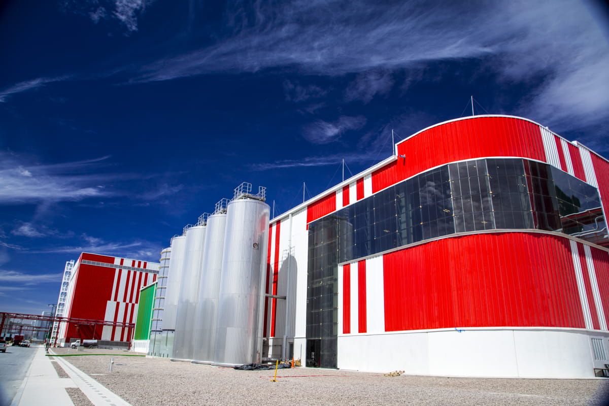 Outside view of Heineken factory façade incorporating Amorphous Silicon Photovoltaic Technology Glass by Onyx Solar