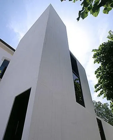 Front view of Cabinet House Amorphous Silicon Façade and Skylight incorporating Amorphous Silicon Photovoltaic Technology Glass by Onyx Sola