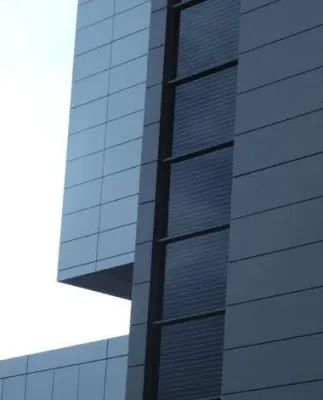 Exterior view of Marqués de Valdecilla Hospital curtain wall incorporating Crystalline Silicon Photovoltaic Technology Glass by Onyx Solar