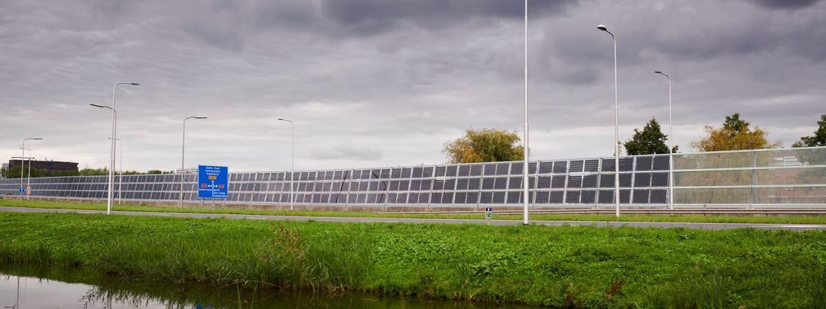 Acoustic barrier constructed with Onyx Solar Photovoltaic Glass