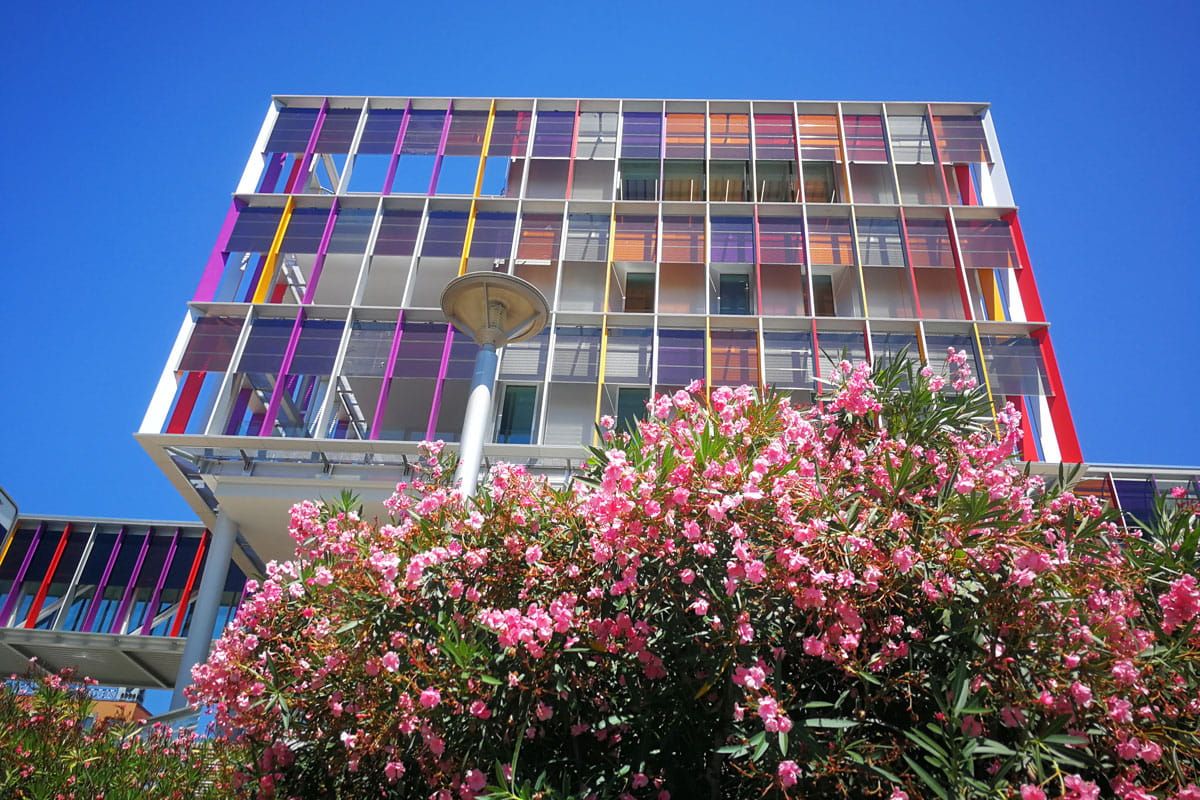 Exterior view of  SJD Pediatric Cancer Center brise soleil incorporating Amorphous Silicon Photovoltaic Technology Glass by Onyx Solar