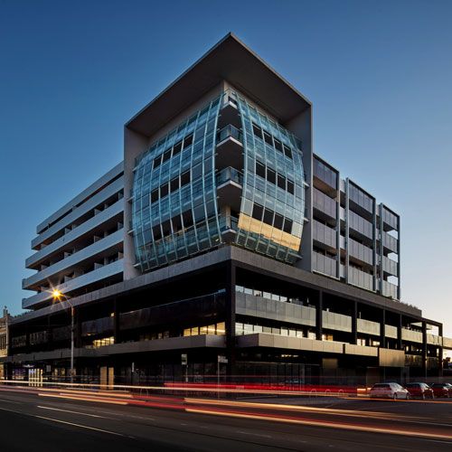 Image of a building integrating solar photovoltaic glass in its facade and railing