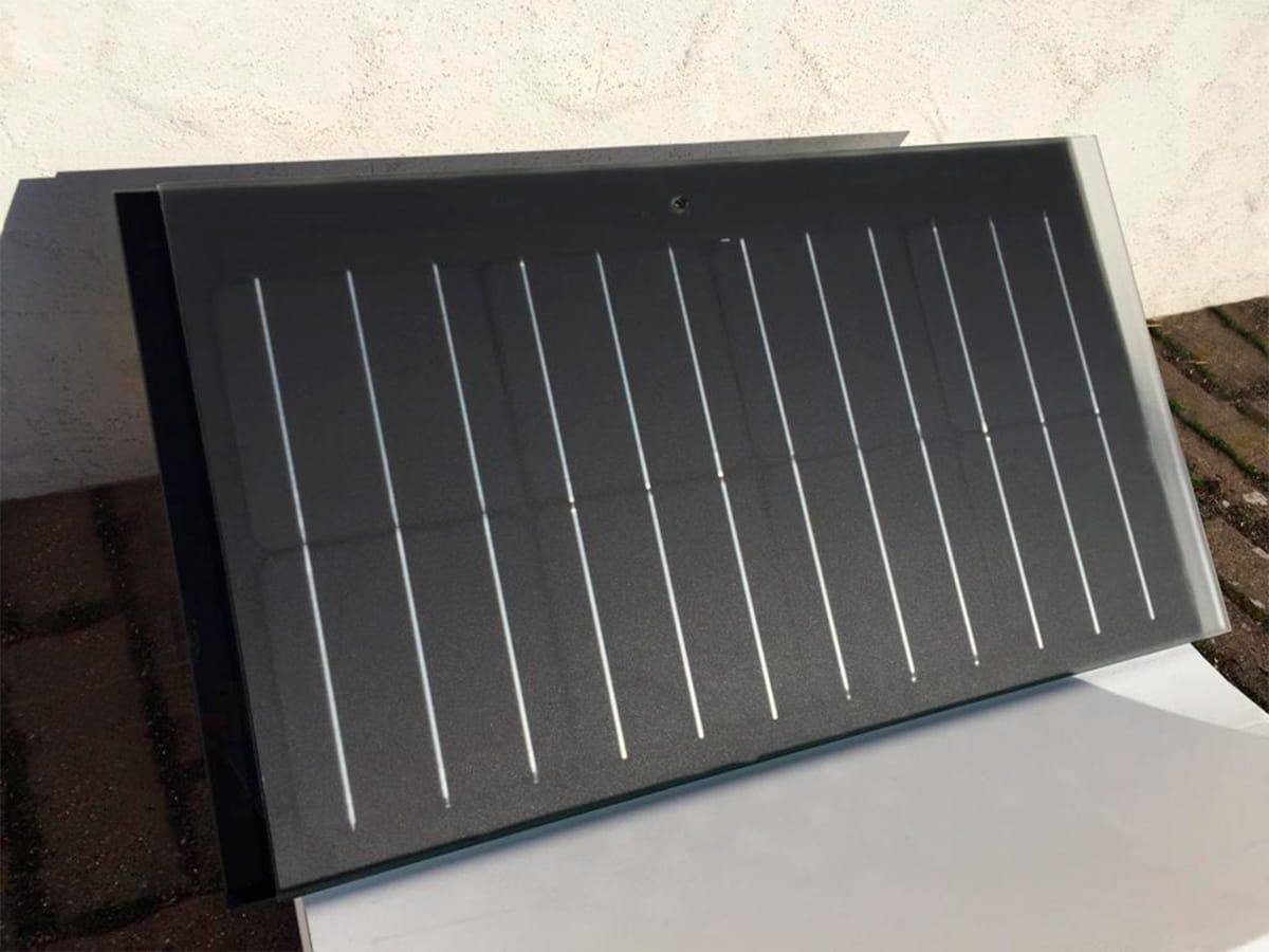 Crystalline Silicon Photovoltaic Technology Glass by Onyx Solar employed on Private House roof tiles 